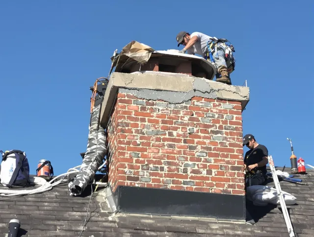 Cerritos Chimney Sweep installing a custom chimney crown in Cerritos, CA