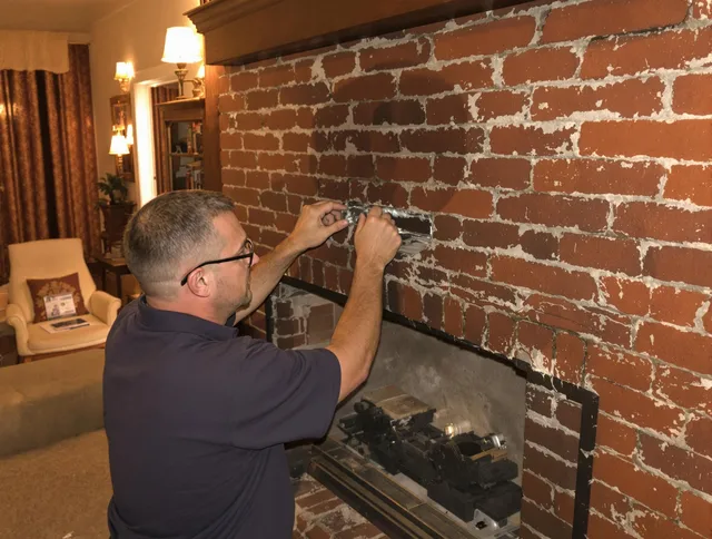 Cerritos Chimney Sweep expert fixing a fireplace in Cerritos, CA